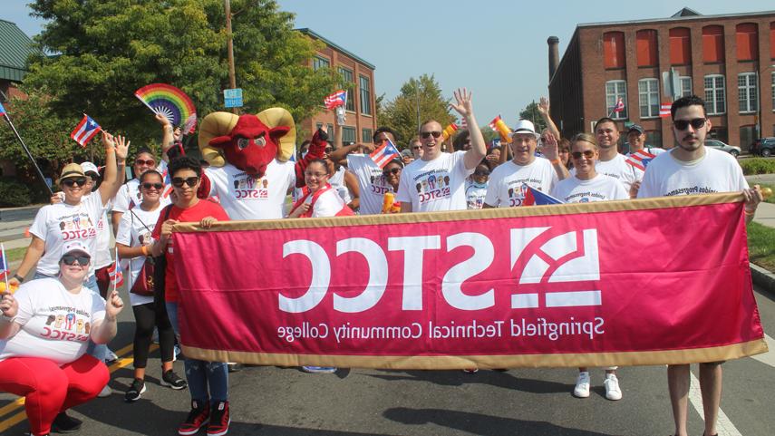 十大彩票平台 community members marching in Puerto Rican Day Parade